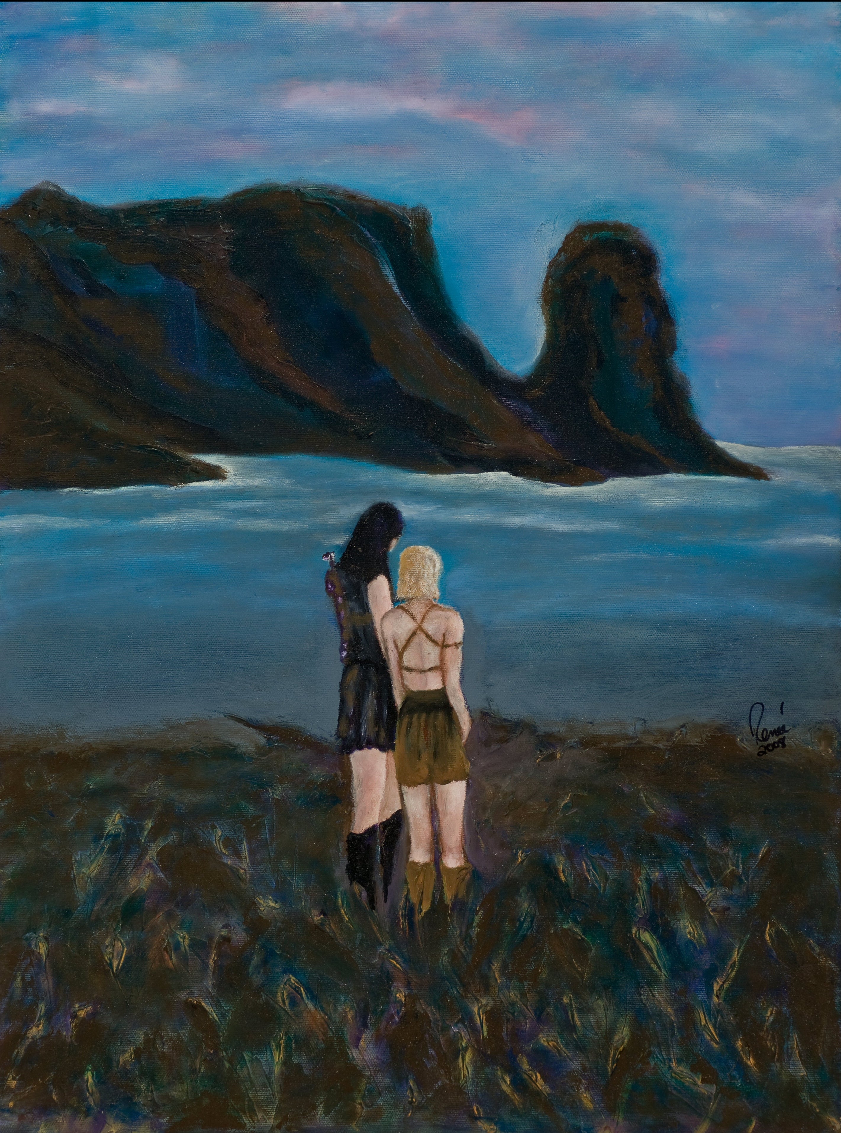 Two people standing on a grassy hill overlooking a body of water with mountains in the background.